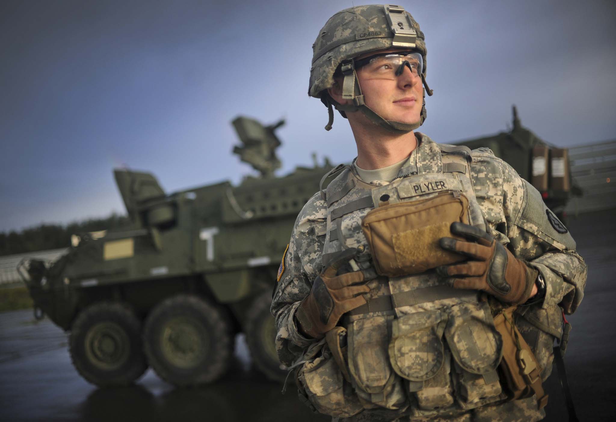 Soldier smiling outside tank